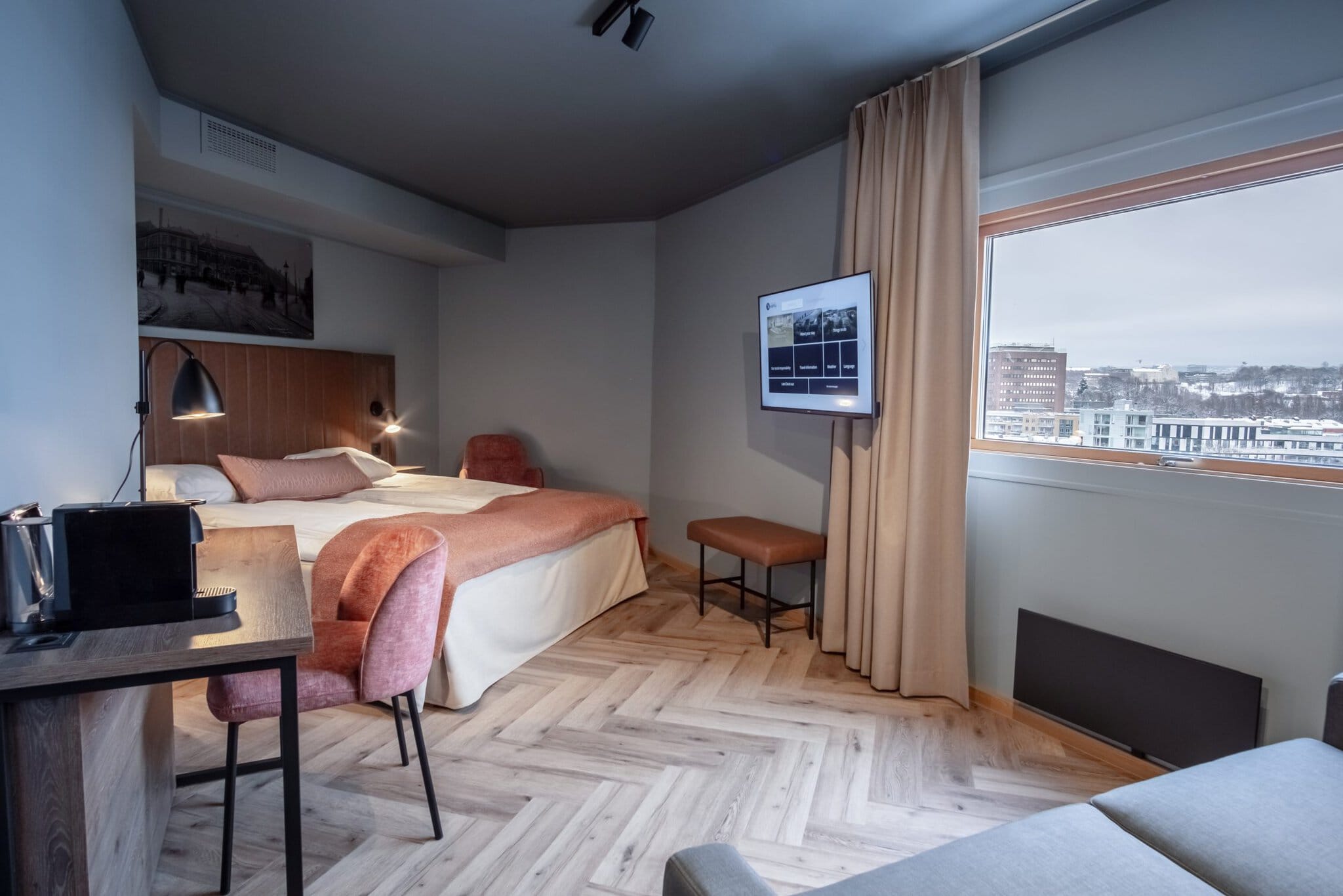 Hotel room with TV and a view towards central Oslo